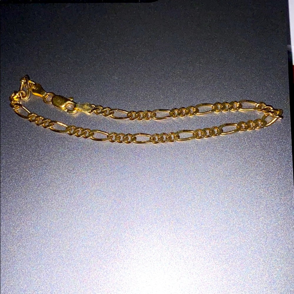 Small gold figaro bracelet. 12ct gold
